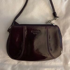 Purple leather wristlet by Coach
